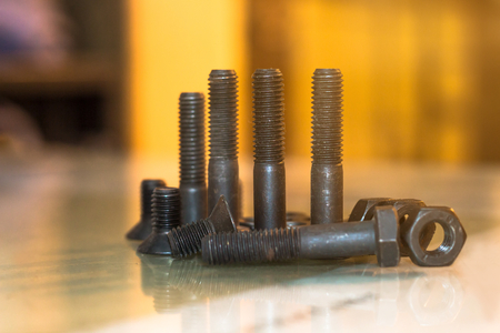 bolts and nuts on glass table in industry prepare for repair work,maintenance