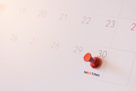 Red push pin on calendar page for remind and marked important events day,red pin in a calender on important date
の写真素材