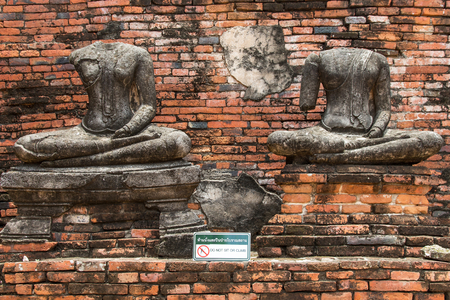 Ruin ancient buddha statues damaged in wat chaiwatthanaram at ayutthaya historical park,Thailandの写真素材