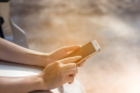 woman hand holding smartphone with big blank screen and modern frame less designの写真素材