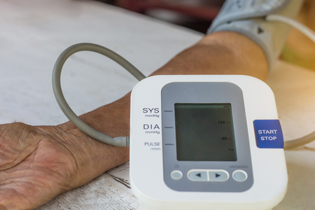 People are check blood pressure monitor and heart rate monitor with digital pressure. Healthcare and...