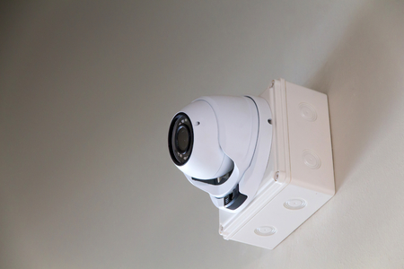 A cctv camera on wall inside the building for watches down below important eventsの写真素材