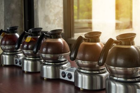 Hot Coffee brake pitcher set for service,many pitcher of hot coffee espresso on the table and light backgroundの写真素材