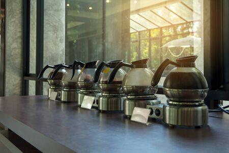 Hot Coffee brake pitcher set for service,many pitcher of hot coffee espresso on the table and light backgroundの写真素材