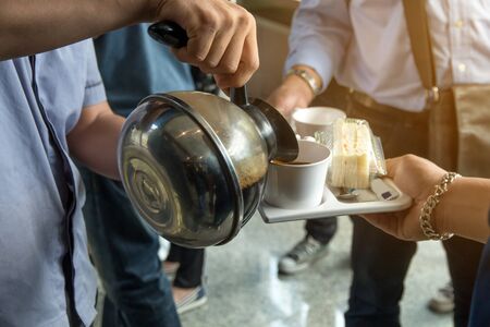 employees are served coffee break between meeting and snack on dish,coffee concept.
