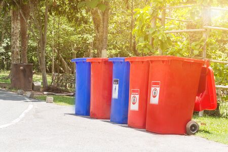 Garbage bins for recycling with recycle colors symbol in the park,Environmental pollution issues.の写真素材