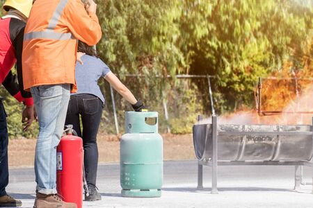 Firefighter training,Instructor training how to use a fire extinguisher for fighting fire
の写真素材