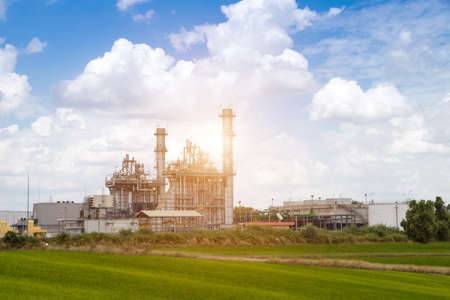 Electric factory power plant and electrical substation on a cloud sky backgroundのeditorial素材