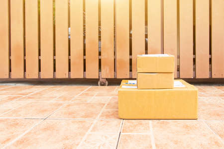 The goods package and sent to receiver at home,Delivery man holding boxes person who sent the...