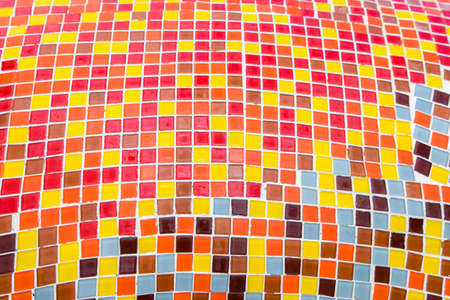 Detail of beautiful old collapsing abstract ceramic mosaic adorned building decorative background,Abstract Pattern,Abstract mosaic colored ceramic stonesの写真素材