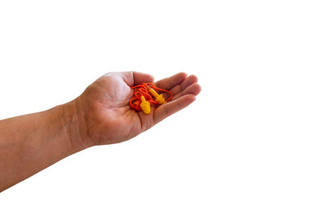 Ear plugs hearing protection in men's hand on white background,safety conceptの写真素材