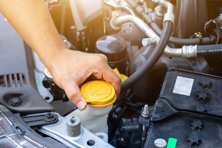 Auto mechanic or driver check system gear old car engine at service station,change and repair before driveの写真素材
