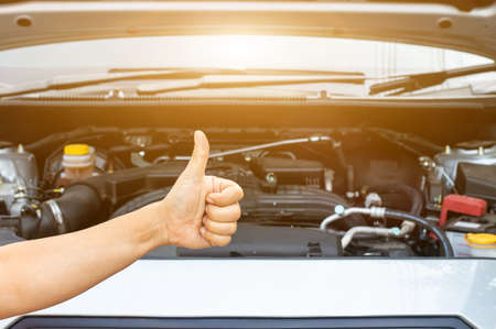 Auto mechanic or driver checks steering and gear system and start system before driving at service...