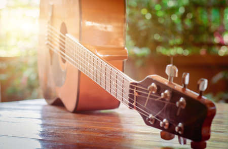 Classical guitar on the table with bokeh background, depth of fieldの写真素材
