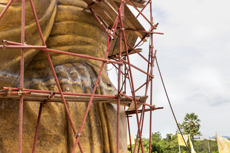Scaffolding for rebuild or repair ancient Buddha statue in construction site,scaffold for constructionの写真素材