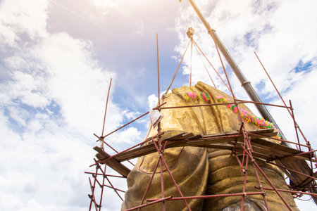 Scaffolding for rebuild or repair ancient Buddha statue in construction site,scaffold for constructionの写真素材