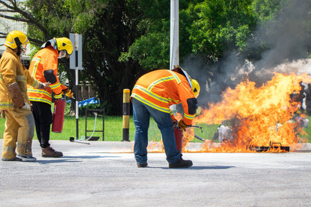 Firefighter training,Instructor training how to use a fire hose extinguisher for fighting fireの写真素材