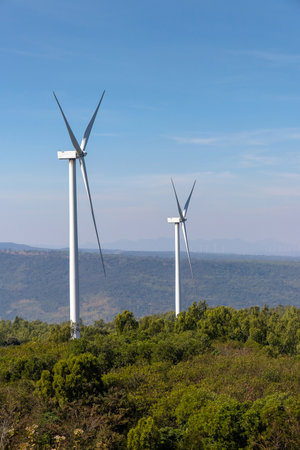 Wind turbines farm on mountanis landscape at Lam Takong Reservoir Views against blue sky with clouds background,Windmills for electric power ecology conceptの写真素材