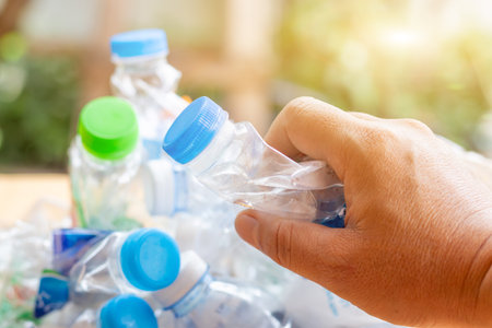 Hand hold old plastic bottles and containers set for recycling,Rubbish, rubbish, garbage, plastic...