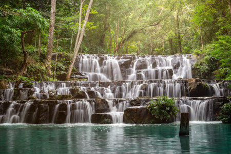 Small waterfall with water splashing and tumbling over the rocks in the forest on a bright sunny,Sam Lan Waterfallの写真素材