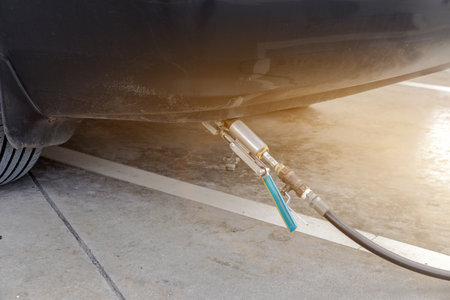 People are adding gas to gas-powered cars,Filling lpg gas powered car,Cars that use gas as fuel at the gas pumpの写真素材