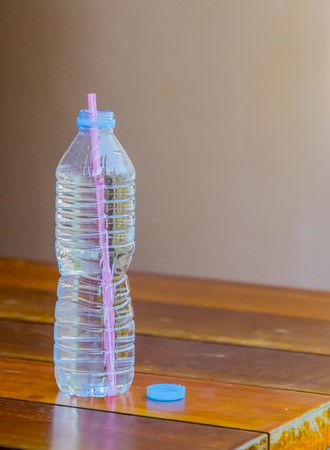 Drinking water from a bottle of water at present is and that clean as possible.の写真素材