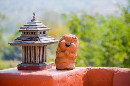 Clay doll decorations can be placed at different locations to point out that up.の写真素材