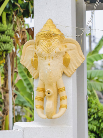 Statue of an elephant's head can be mounted on the wall for decoration.の写真素材