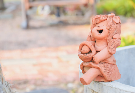 Clay doll decorations can be placed at different locations to point out that up.の写真素材