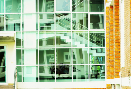 The walls are lined with mirrors to add light to the space within the building as well.の写真素材