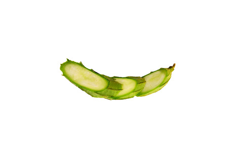 When the zucchini, cut into pieces and placed on a white background.の写真素材