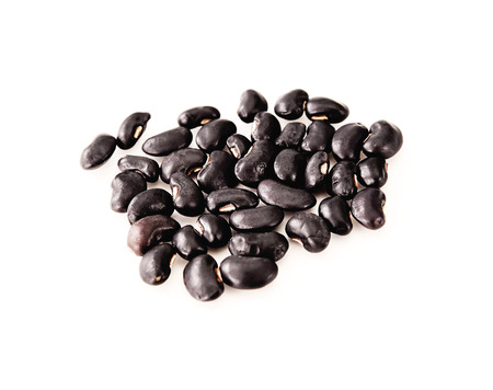 Black beans have been placed on a white background.の写真素材