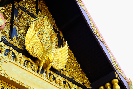 A peacock statue was erected on the gable of the church.の写真素材