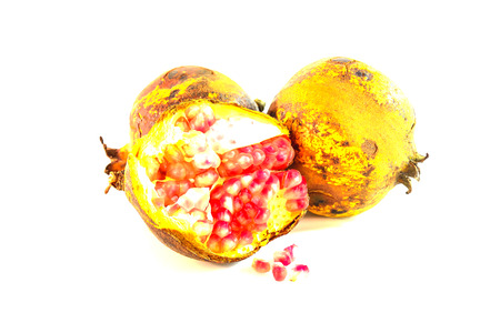 The pomegranate was removed from the shell and placed on a white background.の写真素材