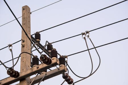 The hotline clamp is connected to the main cable to supply electricity to other places.の写真素材