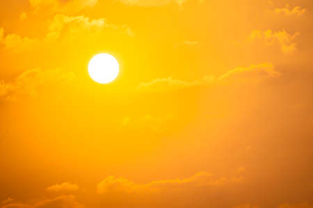 The sun was falling by a cloud blocking the sun out.の写真素材