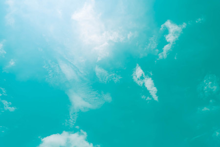 blue green sky background with white cloudの写真素材