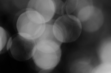 Black bokeh texture on black backgroundの写真素材