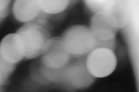 Black bokeh texture on black backgroundの写真素材