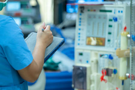 Nurses are checking the function of the hemodialysis machine before use in patients with chronic renal failure.の写真素材