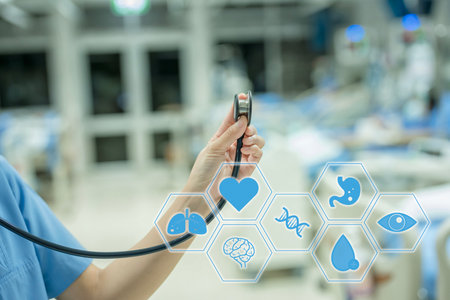 Doctor using stethoscope to check heart beat rate in the hospital.の写真素材