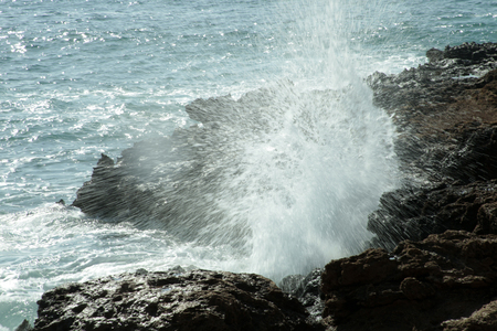 Turquoise colored wavy sea の写真素材