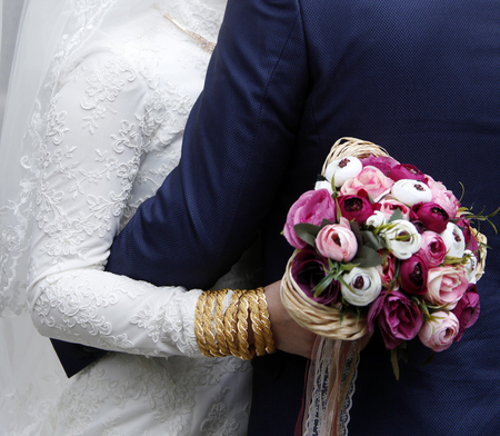 wedding bouquet in hands of brideの写真素材