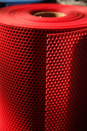 Colorful and perforated plastic gridの写真素材