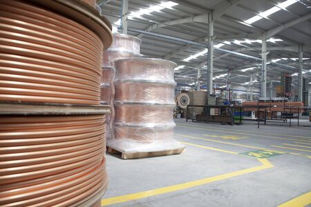 new copper pipes at the factoryの写真素材