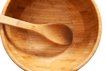 Bamboo plate and spoon on a white background.
