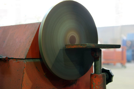 Grinding machine in the factory. Heavy industry. Industrial background.