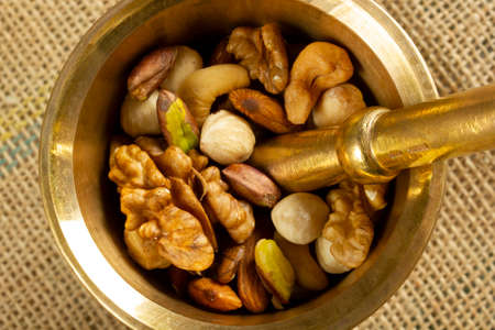 mixed nuts morter and pestleの写真素材