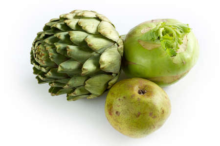 Healthy green colored vegetables and fruits. Artichoke, Kohlrabi, Pear.