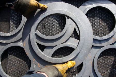 worker and newly manufactured pulleys